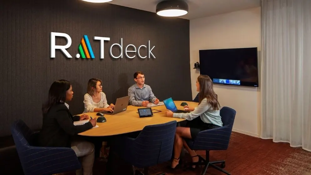 RATdeck team collaborating around a conference table